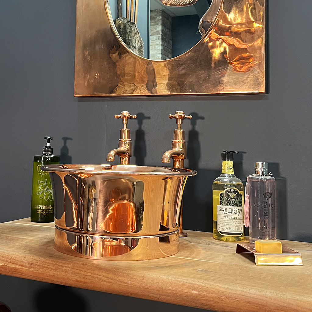 copper round tub basin with roll top range